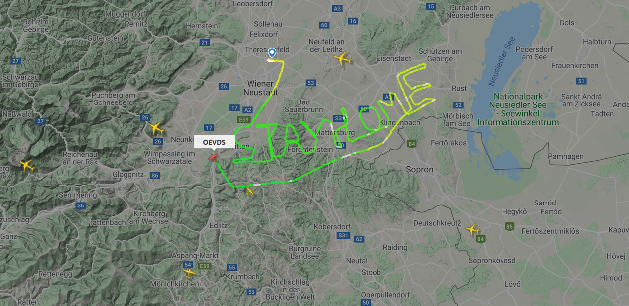 Austrian pilot writing "stay home" with his flight route.
